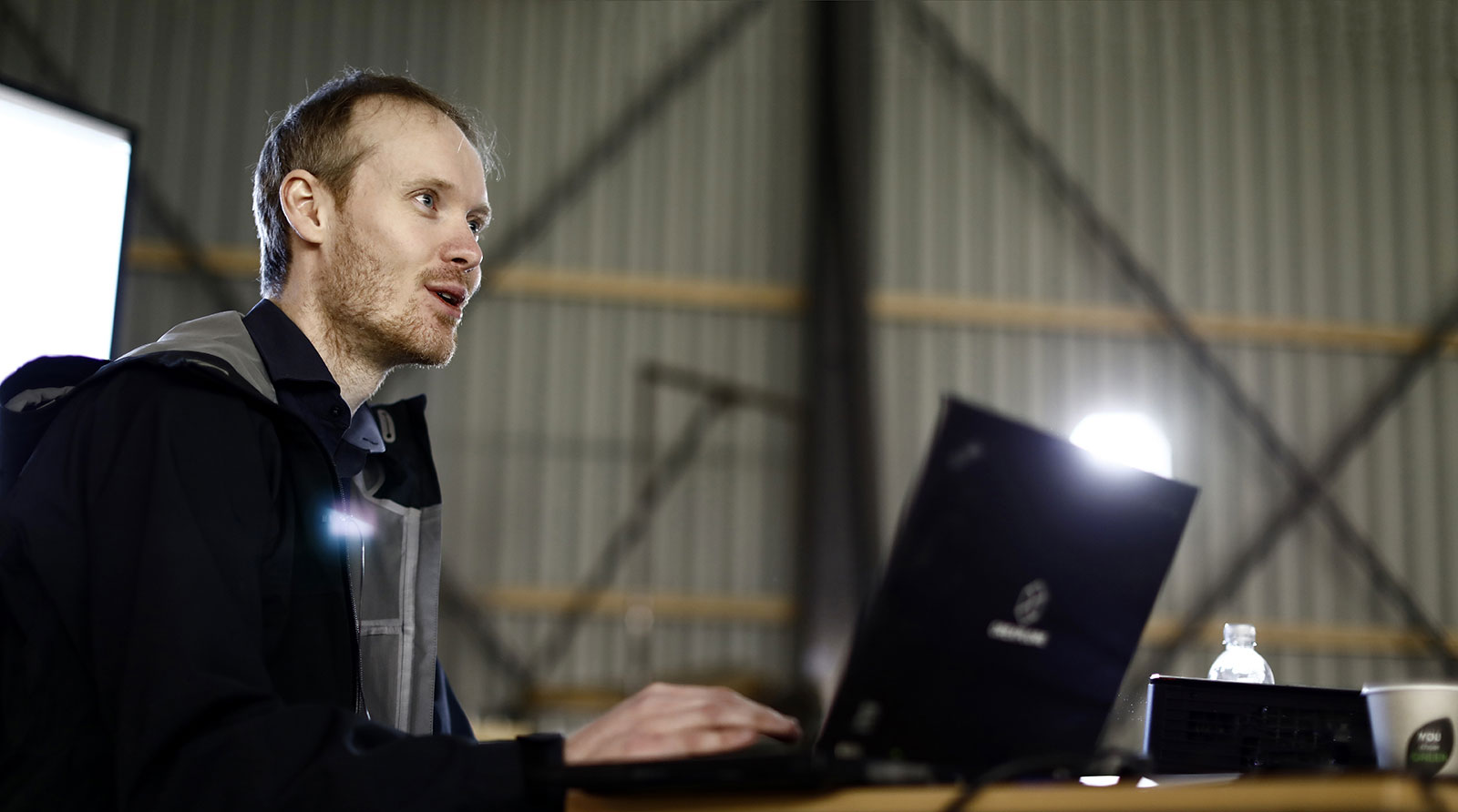 Photograph of man on computer